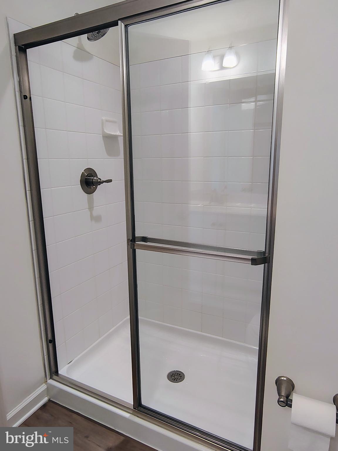 136 Tuxford Road Falling Waters, WV 25419 - Photo 20 of 27 a bathroom with a glass shower door