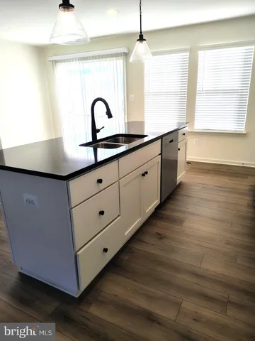 a kitchen with sink and window