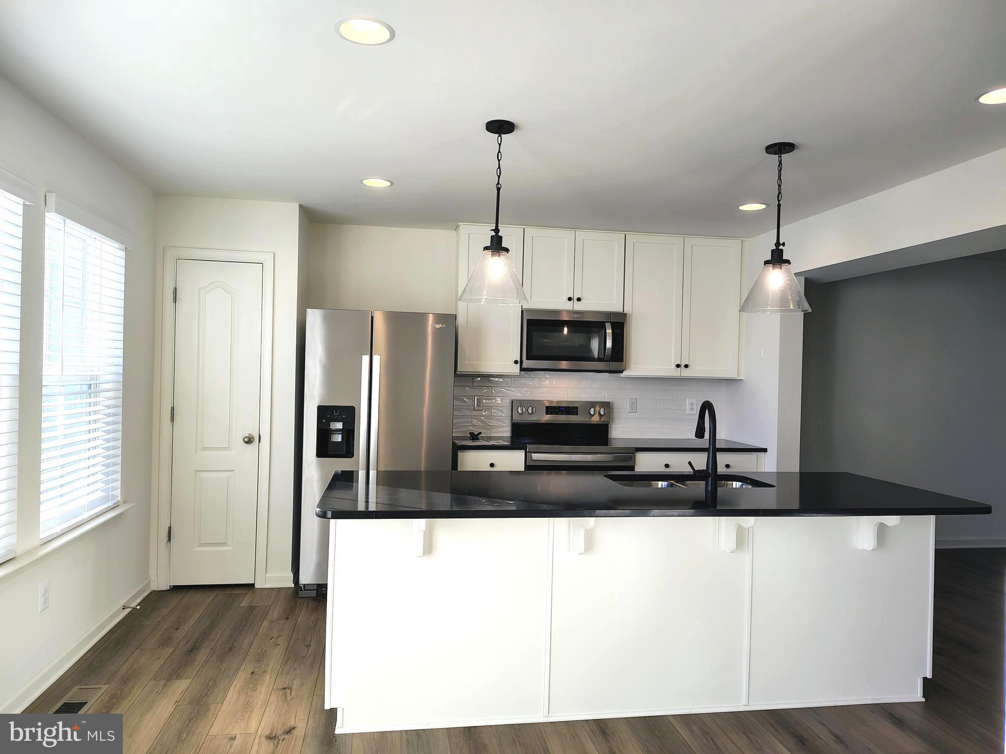 136 Tuxford Road Falling Waters, WV 25419 - Photo 7 of 27 a kitchen with stainless steel appliances a refrigerator sink and microwave