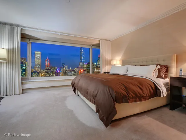 a spacious bedroom with a bed and window