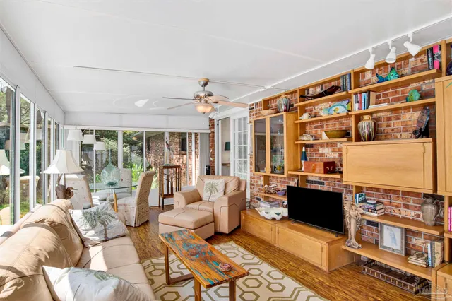 a living room with furniture fireplace and rug