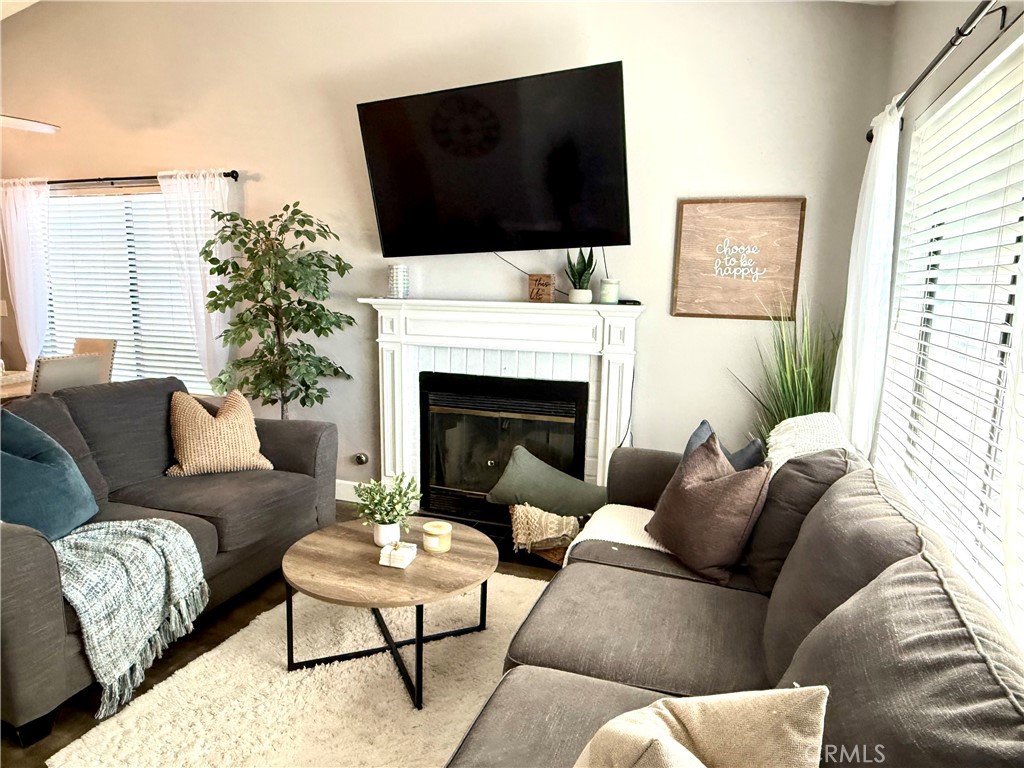 377 Quandt Ranch Road San Jacinto, CA 92583 - Photo 16 of 37 a living room with furniture fireplace and flat screen tv