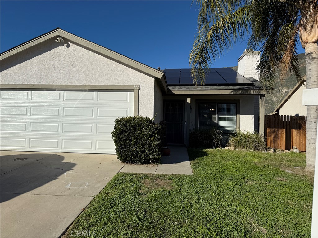 377 Quandt Ranch Road San Jacinto, CA 92583 - Photo 2 of 37 a front view of a house with a yard