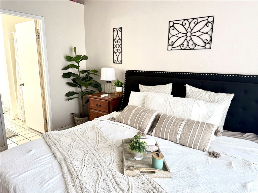 377 Quandt Ranch Road San Jacinto, CA 92583 - Photo 24 of 37 a bedroom with a bed and a painting on the wall