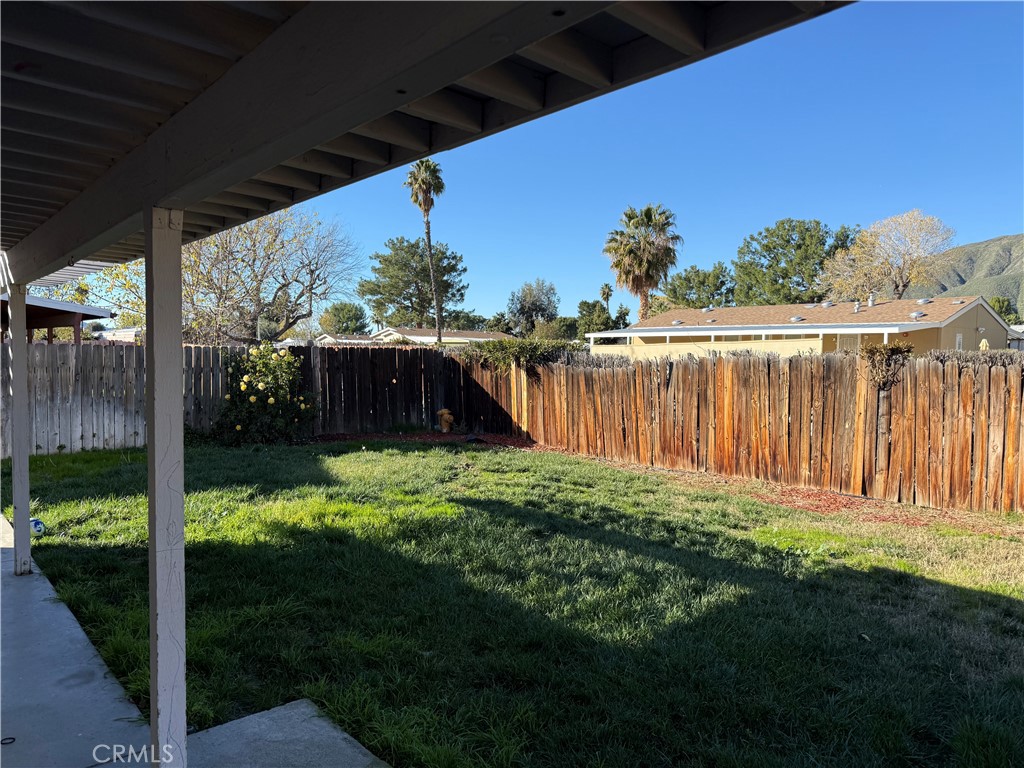377 Quandt Ranch Road San Jacinto, CA 92583 - Photo 31 of 37 a backyard of a house with lots of green space