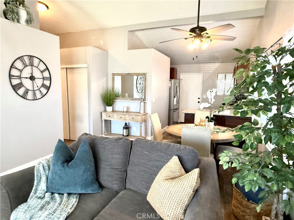 377 Quandt Ranch Road San Jacinto, CA 92583 - Photo 6 of 37 a living room with furniture and a chandelier