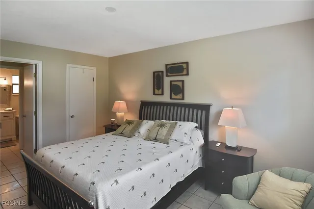 a bedroom with bed and window