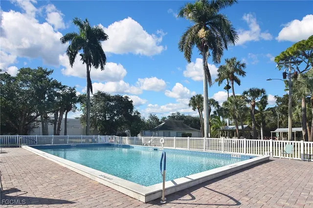 a view of a swimming pool with a yard