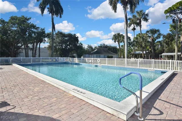 a view of a swimming pool with a backyard