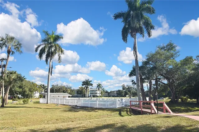 a view of a swimming pool with a table and chairs