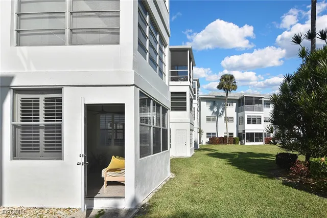 a view of house with yard