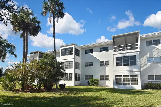 front view of a building with a yard