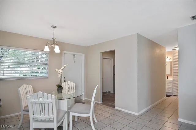 a view of a dining room with furniture and window