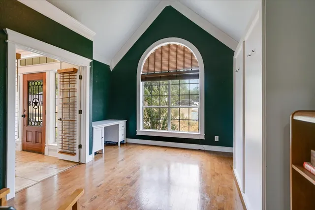 a view of a livingroom with furniture and window