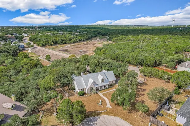 a view of a lush green outdoor space with a lake view