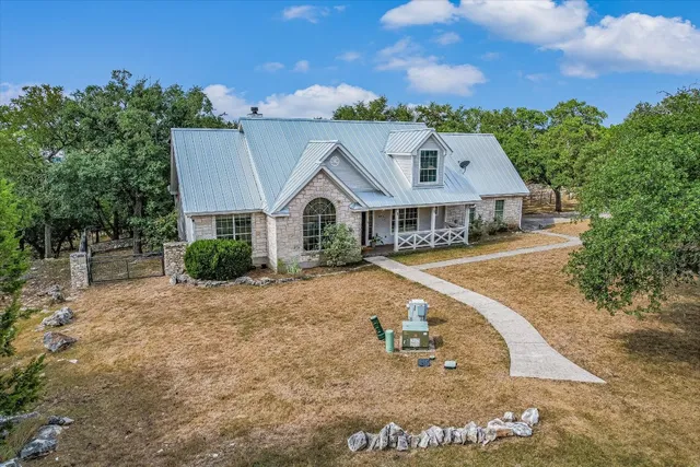 a aerial view of a house with a yard