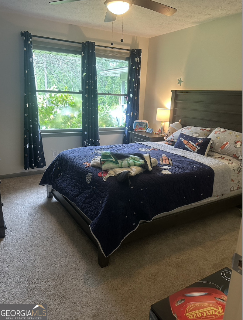 2775 Jackson Road Griffin, GA 30223 - Photo 13 of 30 a bedroom with a bed and window