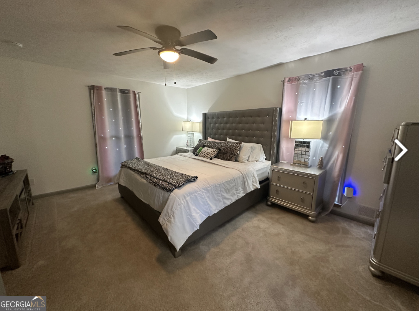 2775 Jackson Road Griffin, GA 30223 - Photo 21 of 30 a bedroom with a bed a couch and dresser