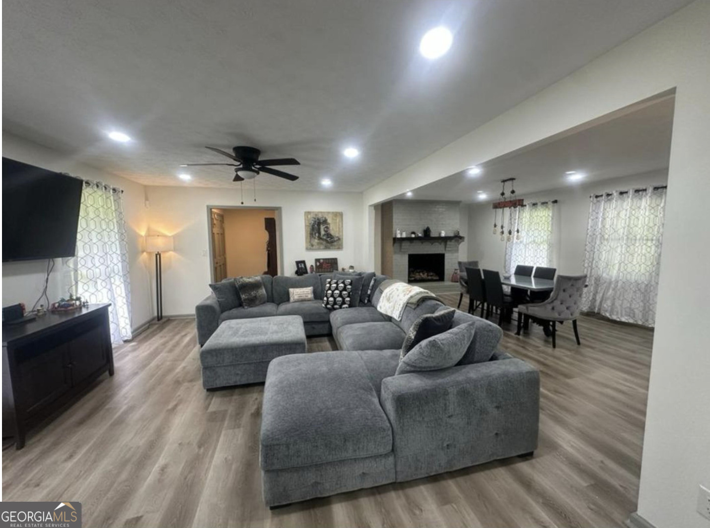 2775 Jackson Road Griffin, GA 30223 - Photo 4 of 30 a living room with fireplace furniture and a flat screen tv
