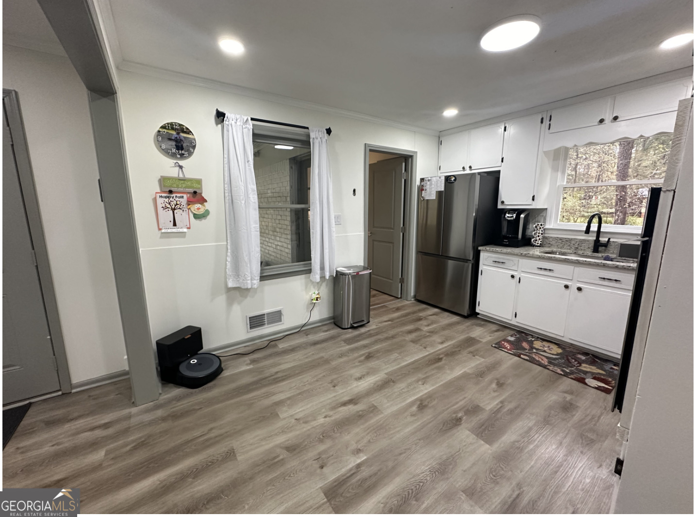 2775 Jackson Road Griffin, GA 30223 - Photo 6 of 30 a view of a kitchen with refrigerator and wooden floor