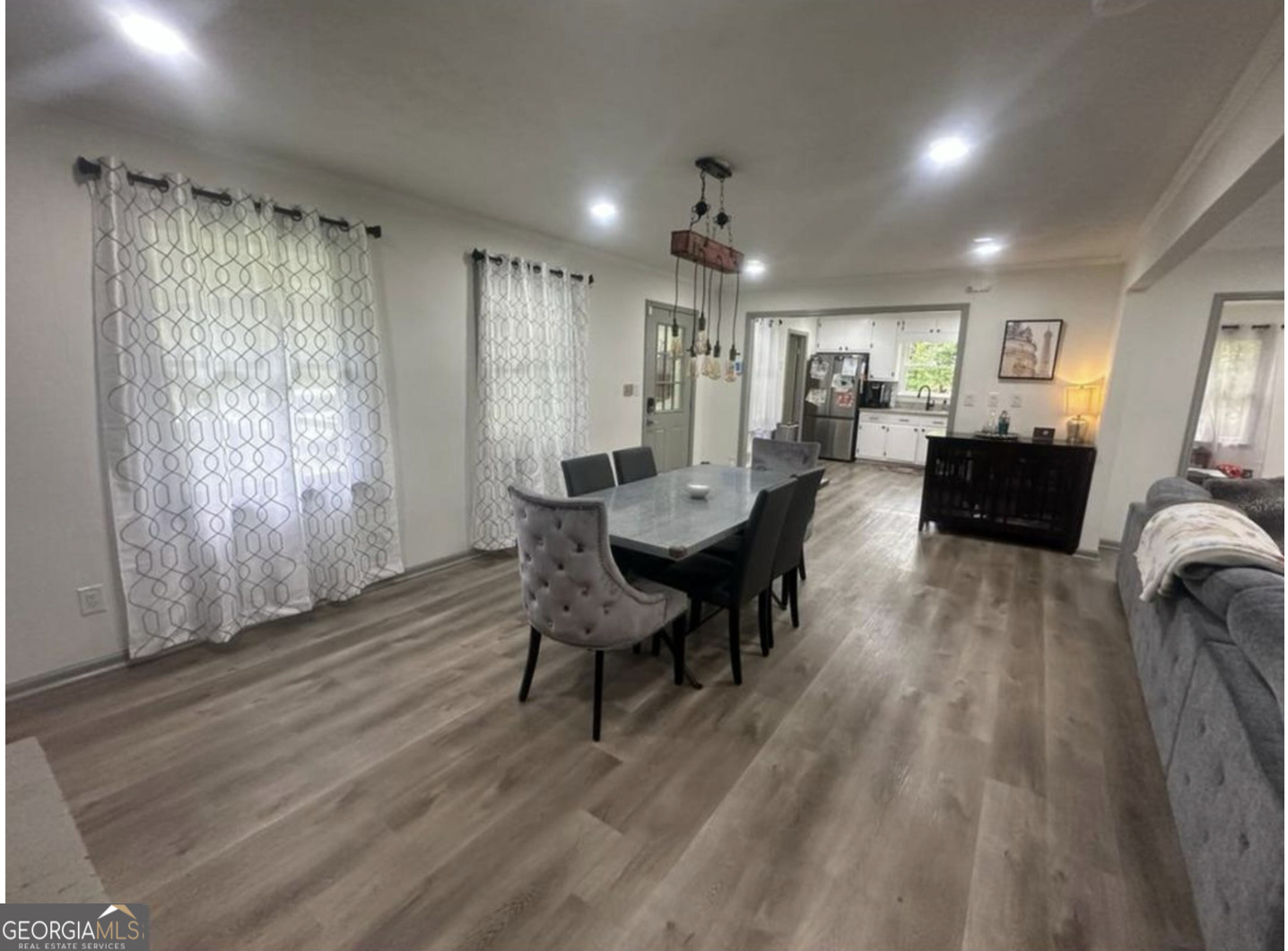 2775 Jackson Road Griffin, GA 30223 - Photo 10 of 30 a view of a dining room with furniture window and wooden floor