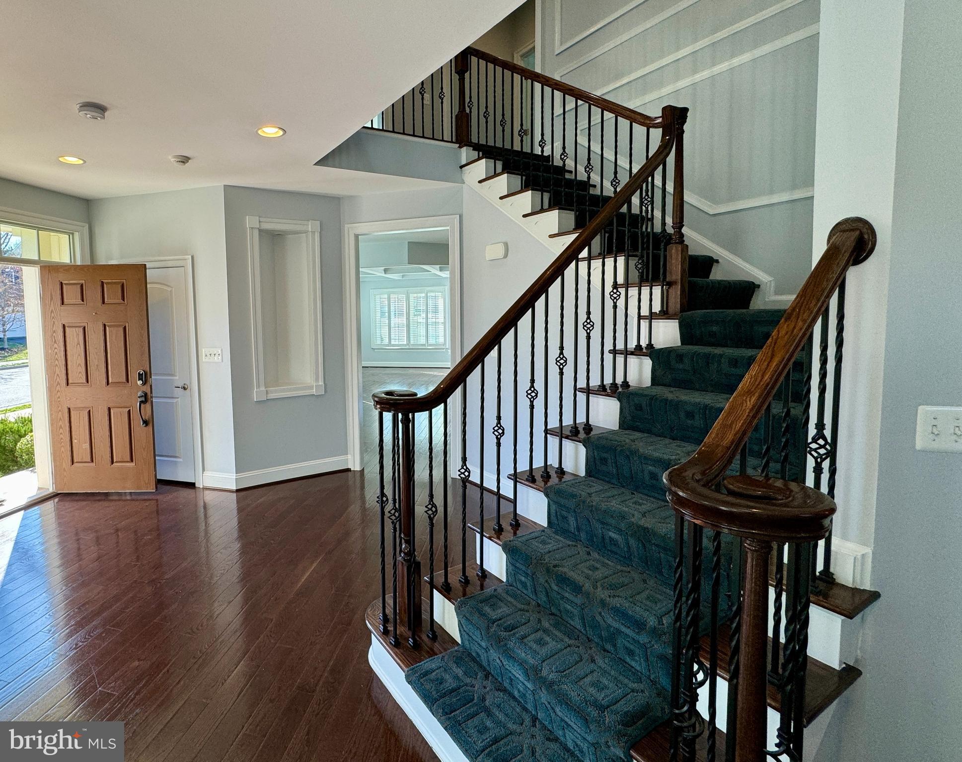 42403 Pine Forest Drive Chantilly, VA 20152 - Photo 11 of 37 a view of entryway with wooden floor and stairs