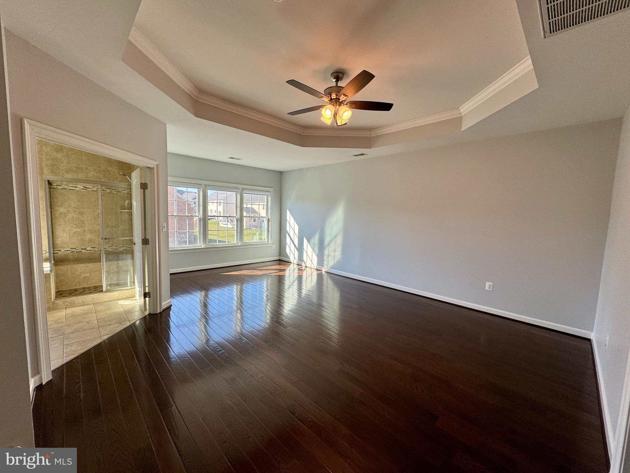 42403 Pine Forest Drive Chantilly, VA 20152 - Photo 13 of 37 a view of an empty room with wooden floor and a window