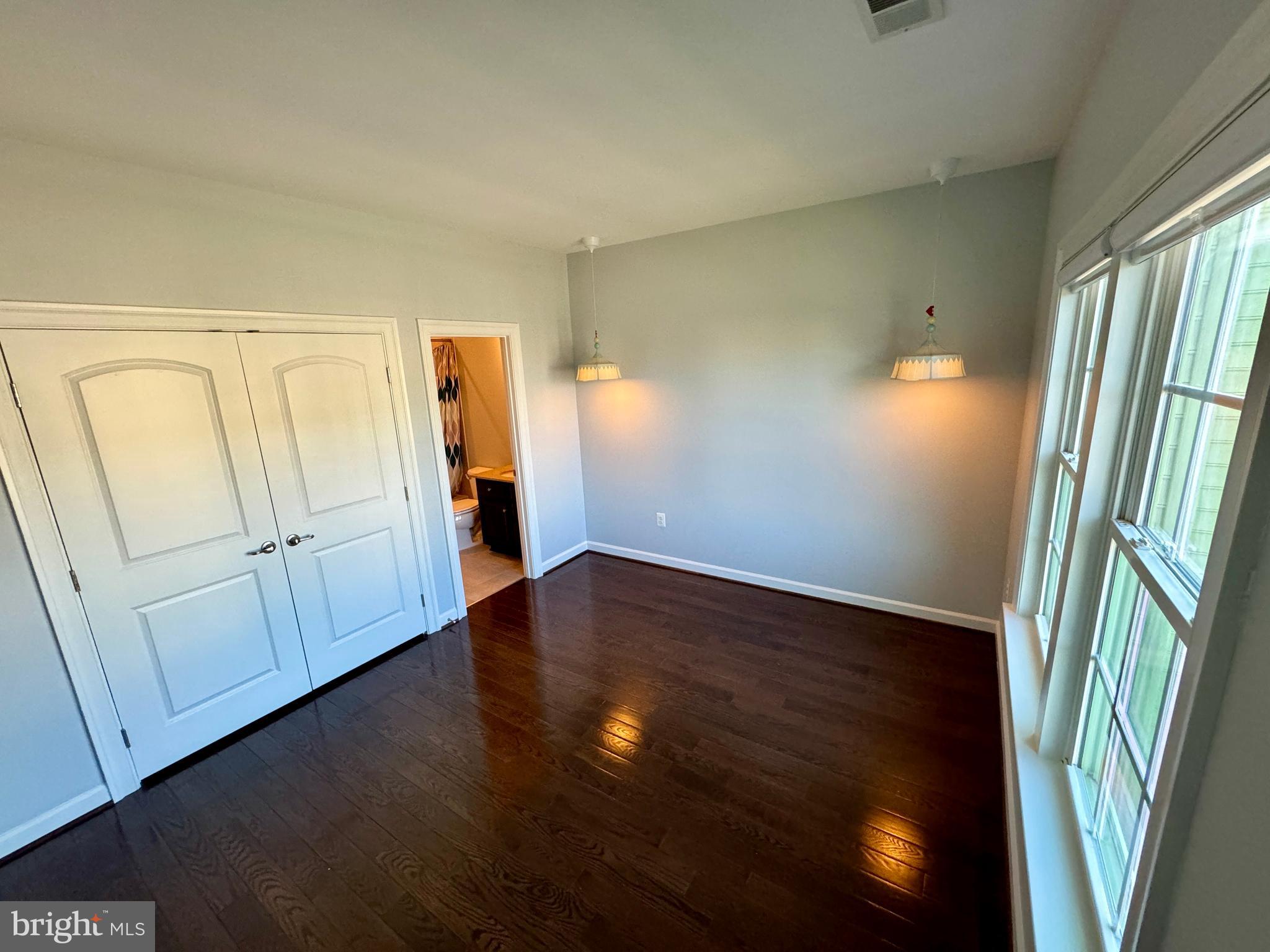 42403 Pine Forest Drive Chantilly, VA 20152 - Photo 19 of 37 a view of an empty room with wooden floor and a window