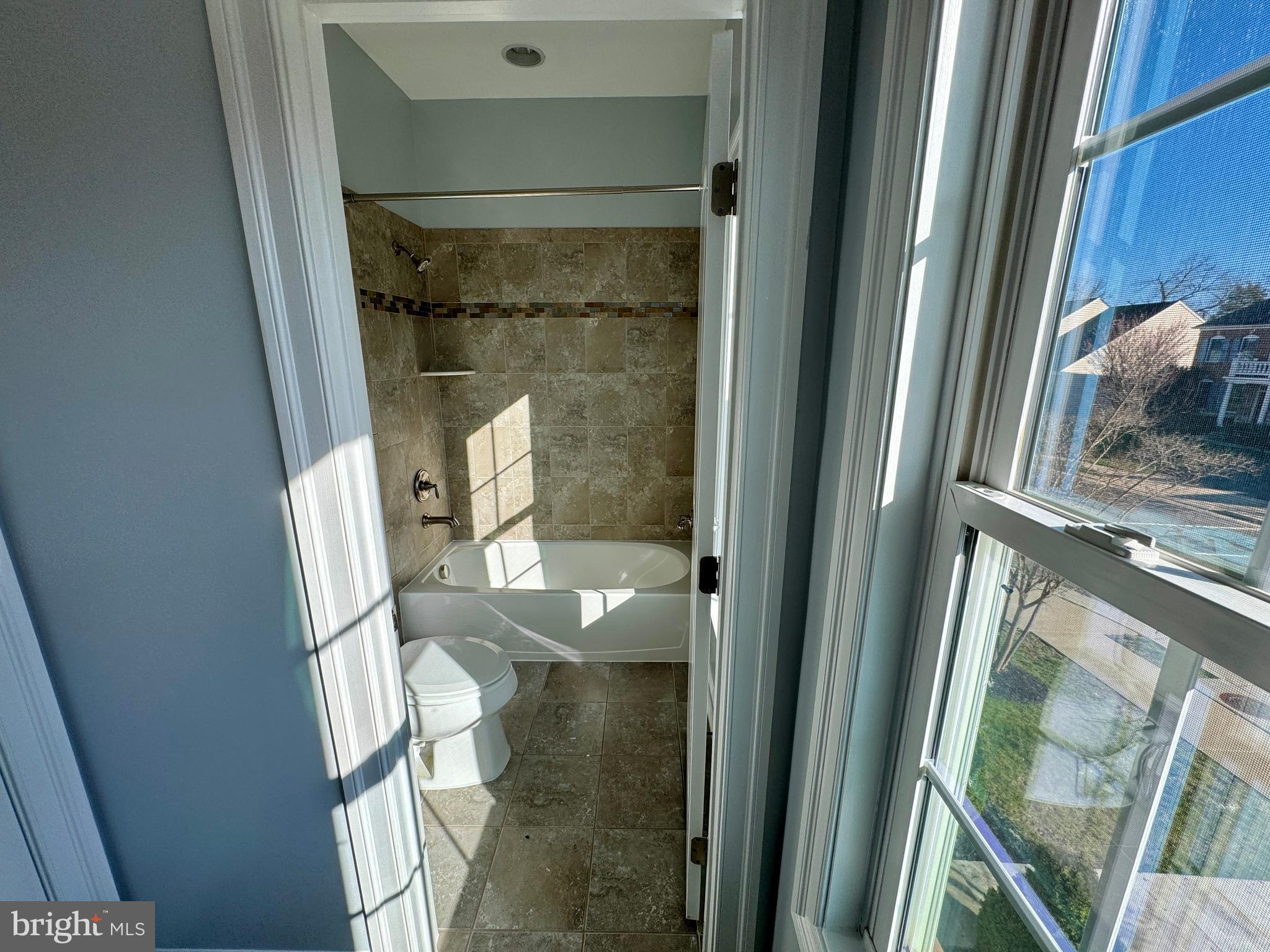 42403 Pine Forest Drive Chantilly, VA 20152 - Photo 26 of 37 a bathroom with a glass door shower and toilet