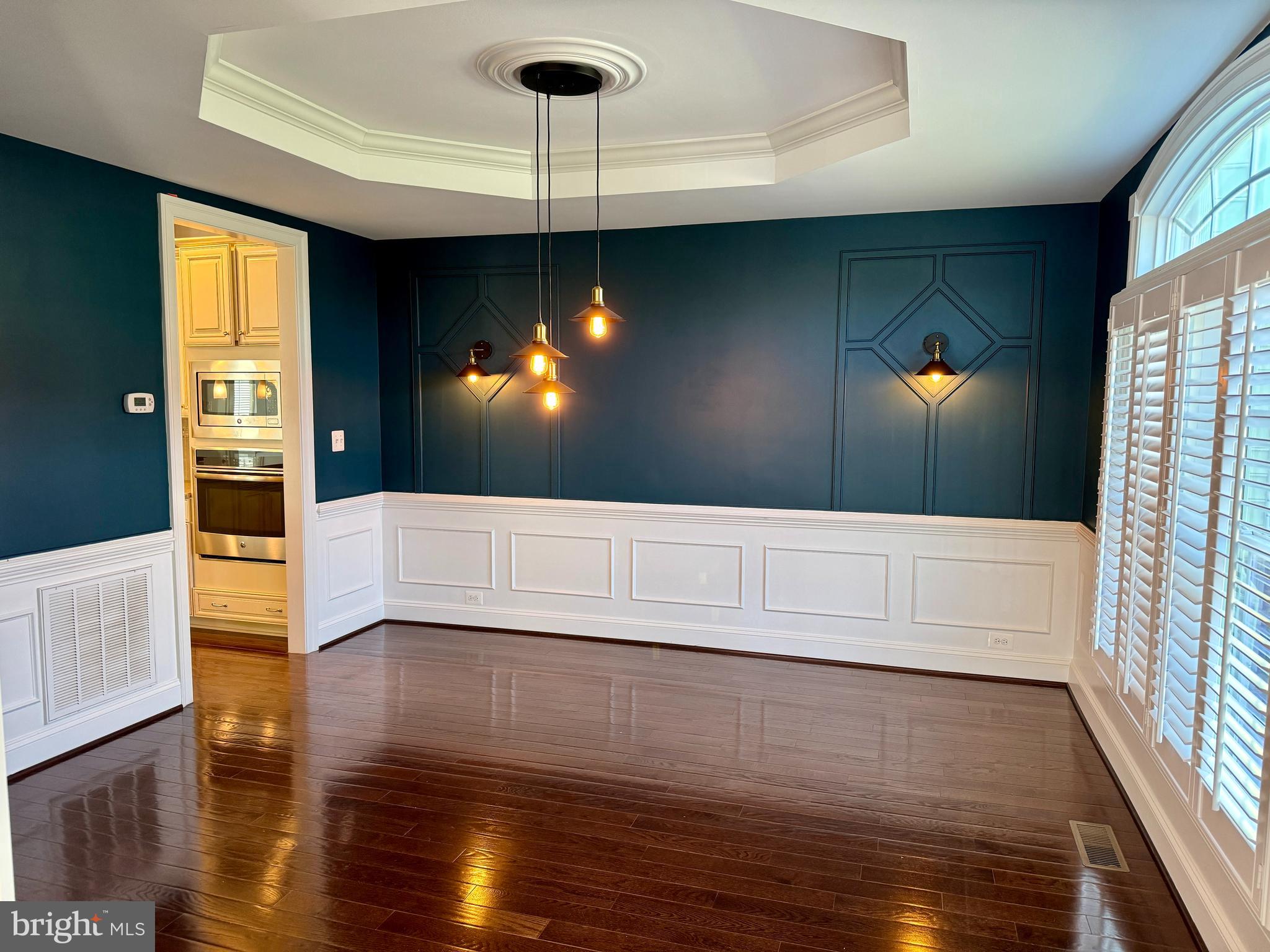 42403 Pine Forest Drive Chantilly, VA 20152 - Photo 9 of 37 a view of a living room with a flat screen tv