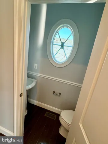 a bathroom with a toilet and a vanity
