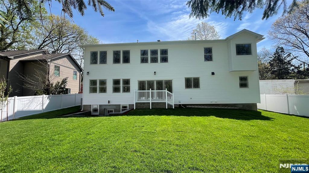 405 Valley Road River Edge, NJ 07661 - Photo 18 of 20 a front view of a house with a garden