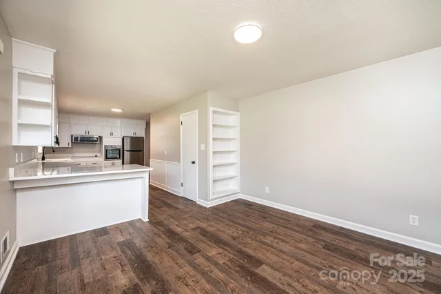 a view of kitchen with wooden floor