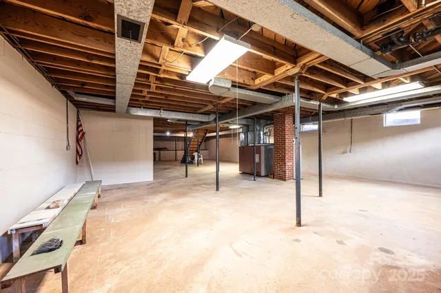 a view of empty room with wooden ceiling