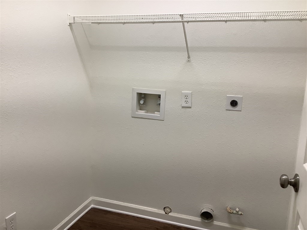 1601 Oak Pl Court Pearland, TX 77581 - Photo 20 of 21 a view of a room with racks on the wall