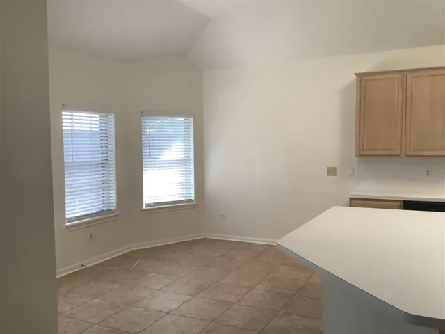 a view of a room that has a window in it