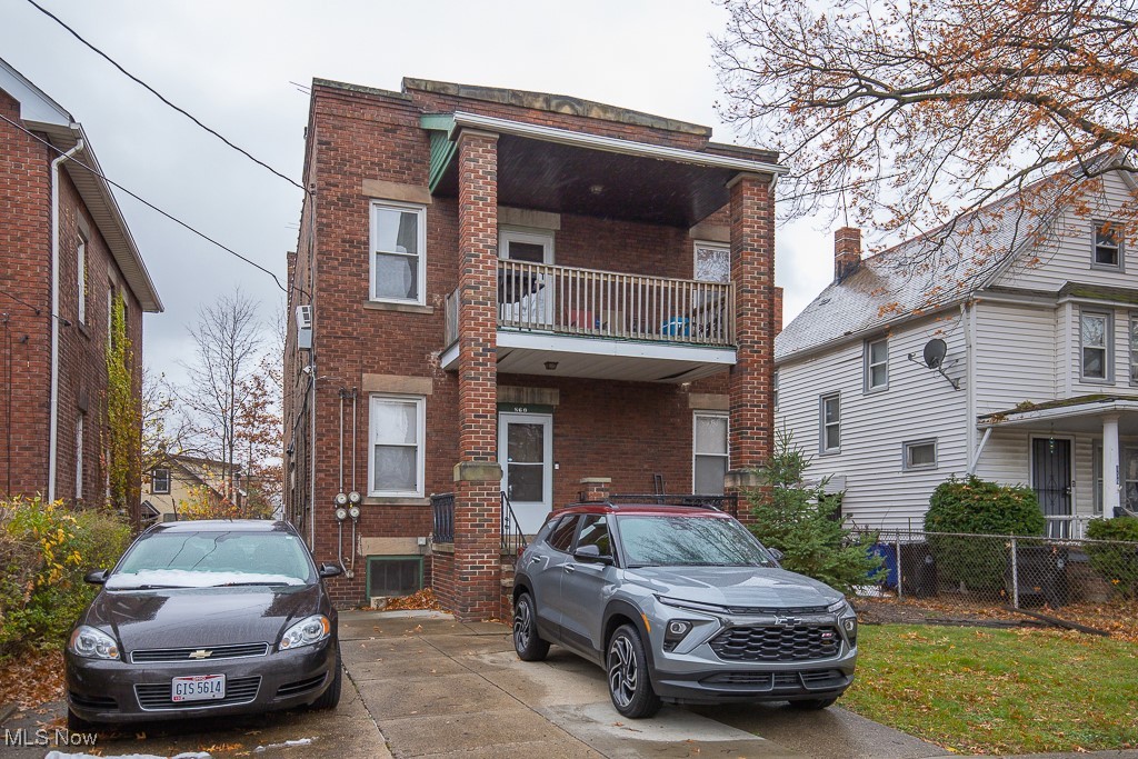 860 Whitcomb Road Cleveland, OH 44110 - Photo 2 of 12 View of front of house featuring a balcony