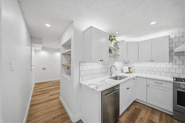 a bathroom with a sink and shower