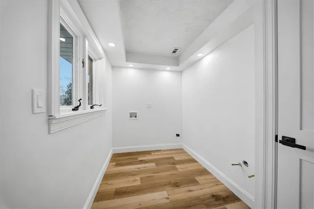 a kitchen with a sink appliances and cabinets