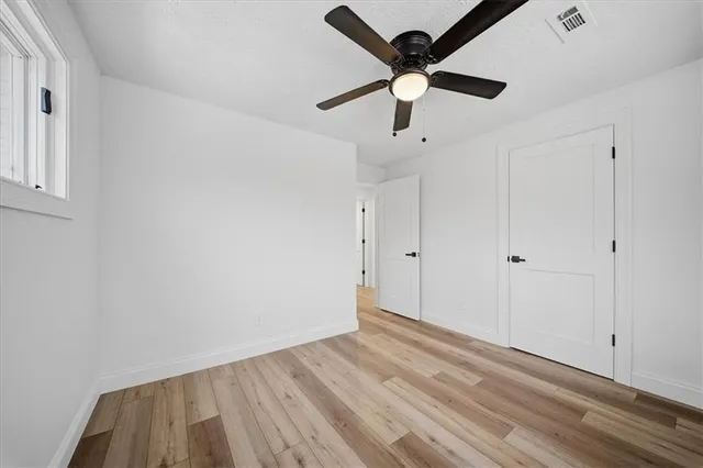 a bed room with a bed and a window