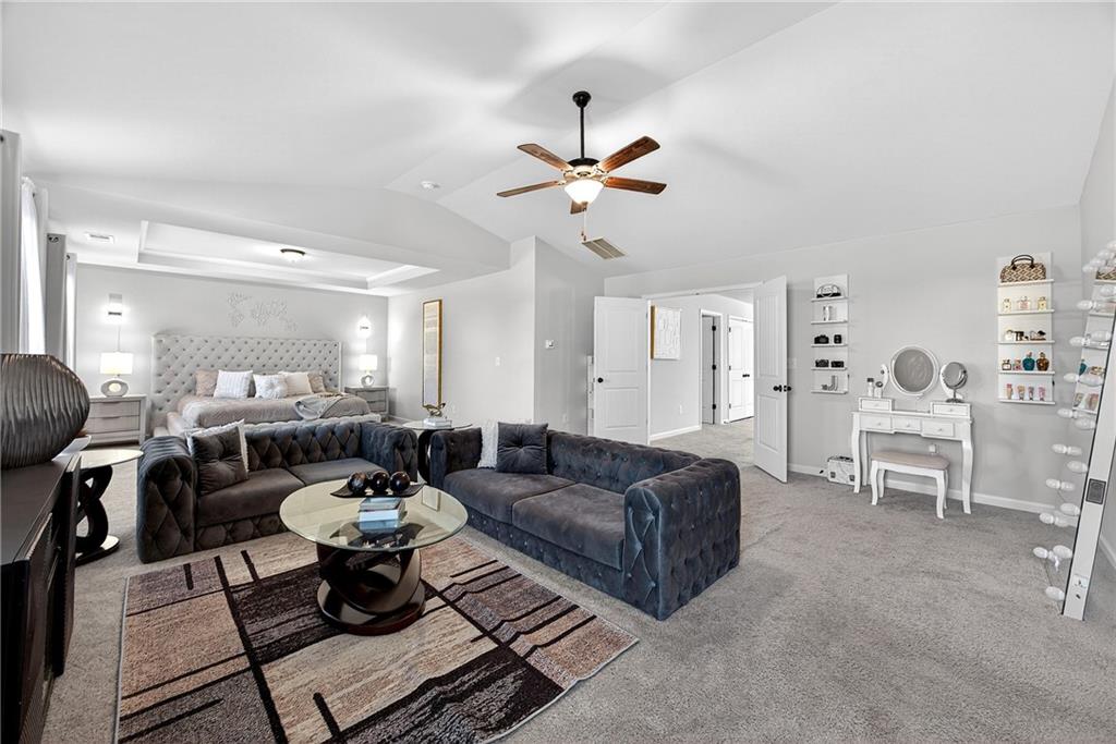 4827 Sultana Way Atlanta, GA 30331 - Photo 11 of 24 a living room with furniture a rug and a chandelier