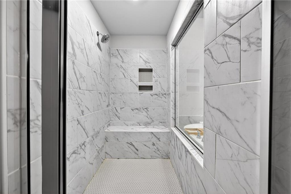 4827 Sultana Way Atlanta, GA 30331 - Photo 13 of 24 a bathroom with a bathtub and a shower