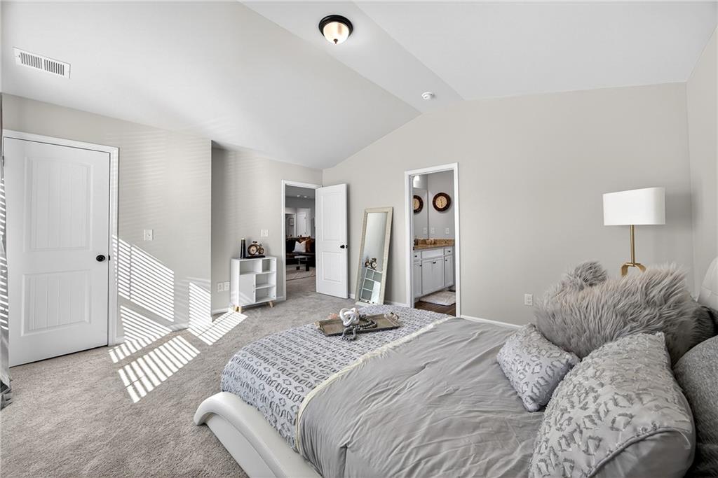 4827 Sultana Way Atlanta, GA 30331 - Photo 15 of 24 a bedroom with a bed and a couch