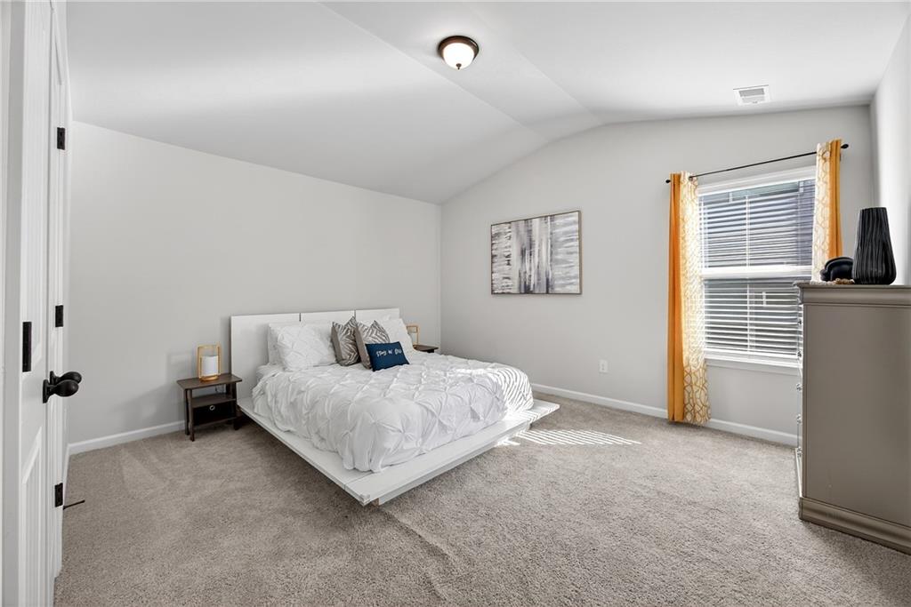 4827 Sultana Way Atlanta, GA 30331 - Photo 18 of 24 a bedroom with a bed and a window