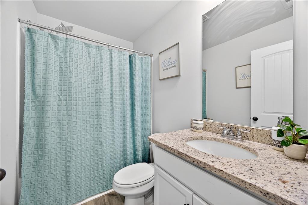 4827 Sultana Way Atlanta, GA 30331 - Photo 20 of 24 a bathroom with a granite countertop sink and a mirror