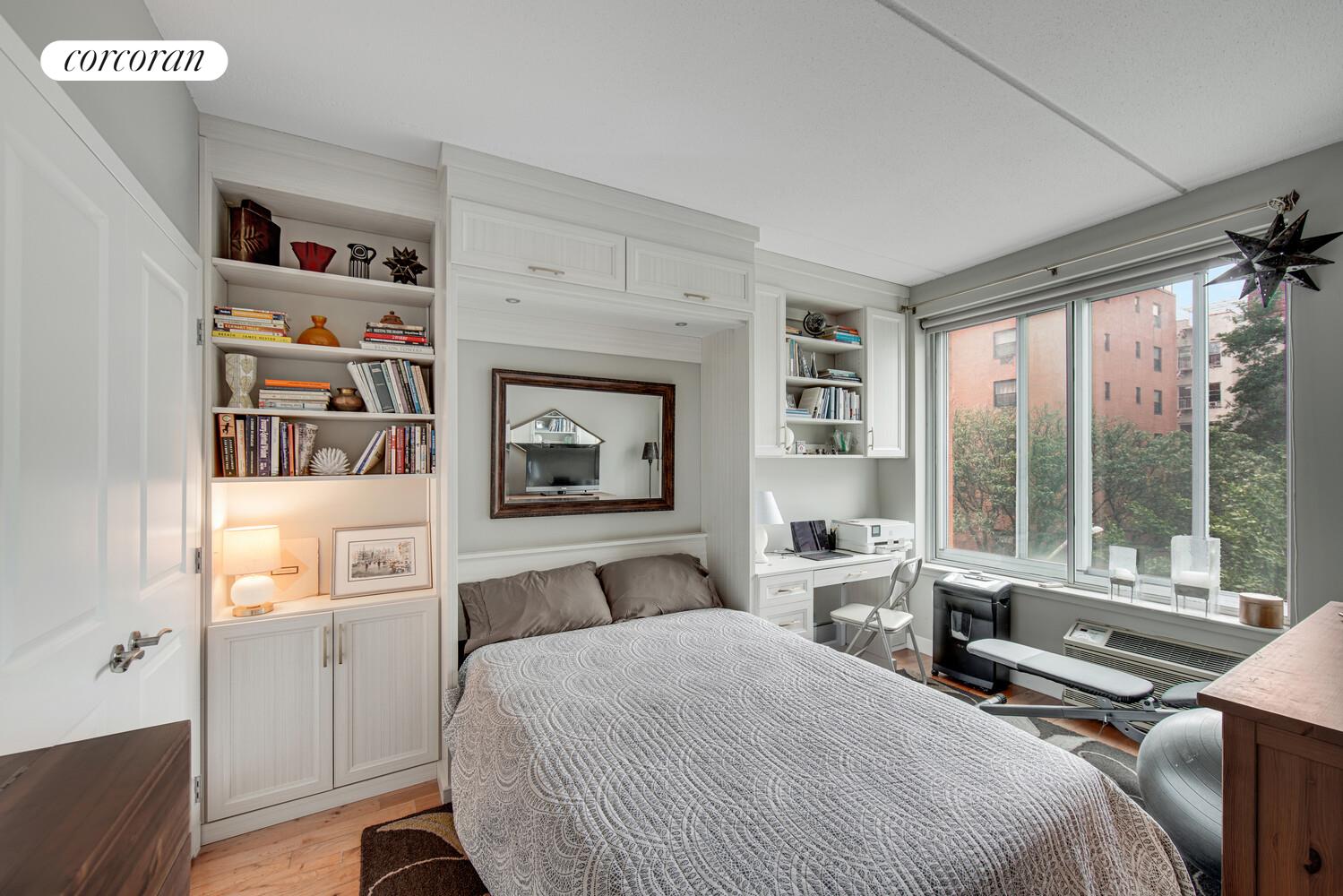 29 West 138th Street, Unit 4H Manhattan, NY 10037 - Photo 11 of 15 a bedroom with a bed furniture and a large window