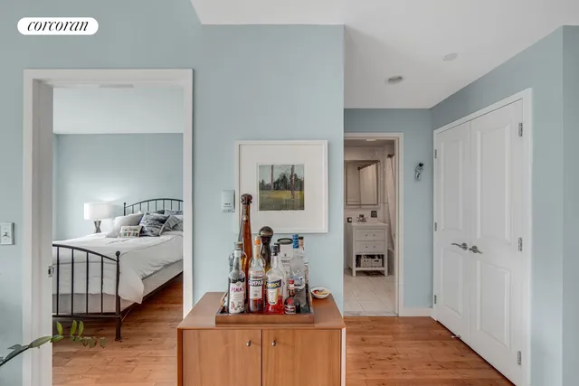a bedroom with furniture and a wooden floor