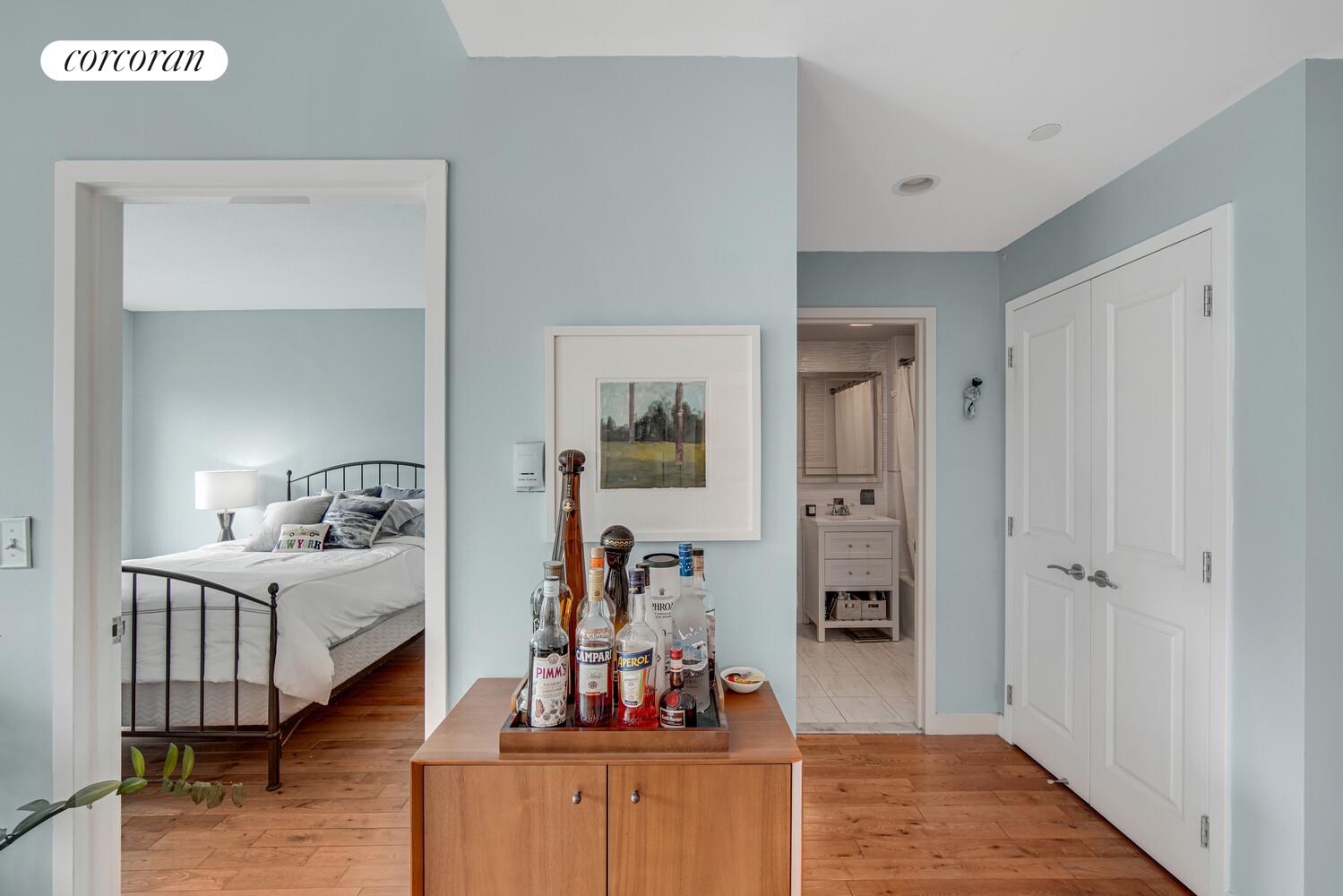 29 West 138th Street, Unit 4H Manhattan, NY 10037 - Photo 9 of 15 a bedroom with furniture and a wooden floor