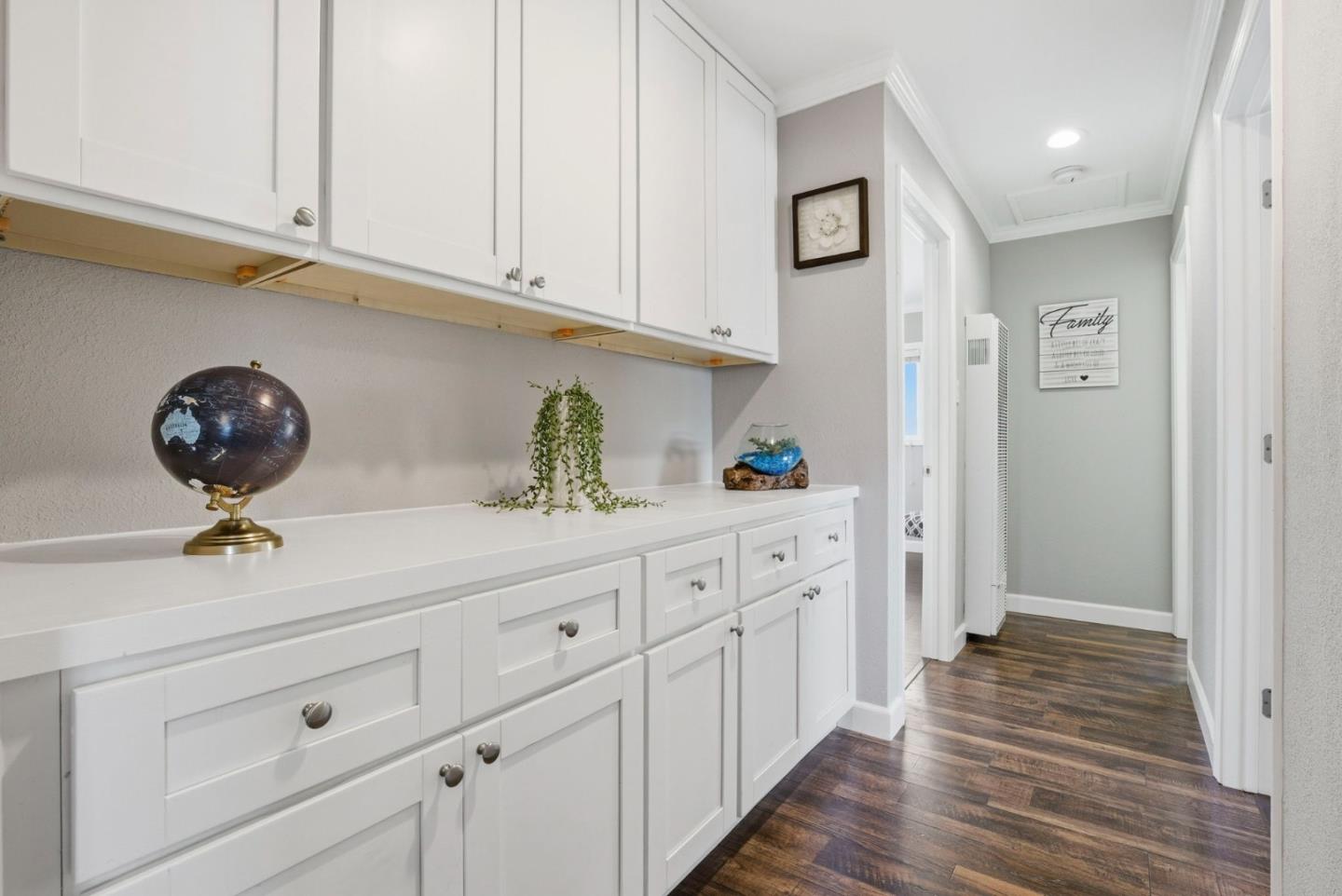 2793 Ruff Court Pinole, CA 94564 - Photo 33 of 53 a kitchen with cabinets and wooden floor