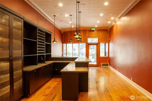 a view of kitchen with wooden floor and windows
